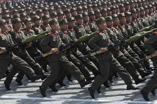 North Korean soldiers march during a mass military parade in Pyongyang's Kim Il Sung Square to celebrate 100 years since the birth of North Korean founder, Kim Il Sung on April 15, 2012. (AP Photo/Ng Han Guan, File)