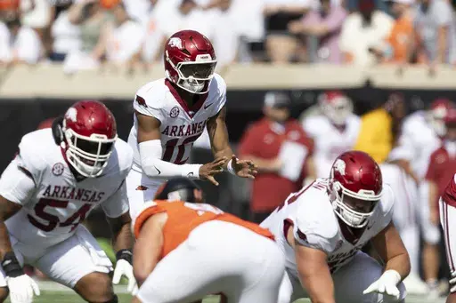Arkansas quarterback Taylen Green (10) takes the snap in the first half of an NCAA college football game against Oklahoma State, Saturday, Sept. 7, 2024, in Stillwater, Okla. (AP Photo/Mitch Alcala)