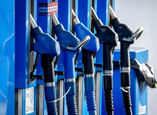 Taps are photographed at a gas station in Frankfurt, Germany, Wednesday, Oct. 5, 2022. A cut in oil production is on the table when OPEC oil-producing countries meet Wednesday. The OPEC+ alliance that includes Saudi Arabia and Russia is weighing a cut of a million barrels per day or more. The idea is to boost oil prices that have fallen from summer highs of over $100 to around $80 for U.S. crude. (AP Photo/Michael Probst)