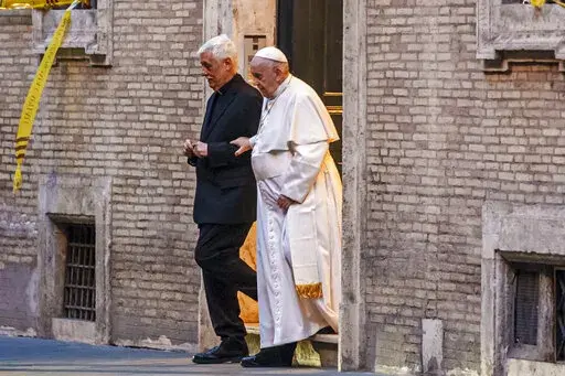 Pope Francis is flanked by Jesuits' superior general Arturo Sosa Abascal, left as he leaves the Church of the Gesu', mother church of the Society of Jesus (Jesuits), after presiding a mass on March 12, 2022. The head of Pope Francis’ Jesuit religious order admitted Wednesday, Dec. 14, 2022, that a famous Jesuit priest had been convicted of one of the most serious crimes in the Catholic Church some two years before the Vatican decided to shelve another case against him for allegedly abusing oth
