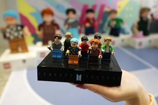 A LEGO set made of its blocks featuring K-pop band BTS, is shown during a publicity event at a store in Seoul, South Korea, on March 2, 2023. Danish toy company Lego said Tuesday March 7, 2023 that its net profit increased by 5% in 2022 coming in at 13.9 billion kroner ($2 billion), up from 13.3 billion kroner a year earlier. (AP Photo/Lee Jin-man, File)
