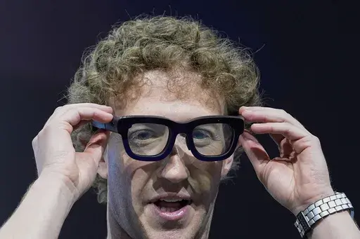 Mark Zuckerberg wears a pair of Orion AR glasses during the Meta Connect conference Wednesday, Sept. 25, 2024, in Menlo Park, Calif. (AP Photo/Godofredo A. Vásquez)