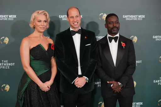Britain's Prince William, Hannah Waddingham, left, and Sterling K. Brown pose on the green carpet for the 2023 Earthshot Prize Awards in in Singapore, Tuesday, Nov. 7, 2023. (AP Photo/Vincent Thian)