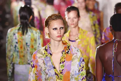 A model wears a creation for the Dries Van Noten ready-to-wear Spring/Summer 2023 fashion collection presented Wednesday, Sept. 28, 2022 in Paris. (Photo by Vianney Le Caer/Invision/AP)