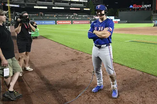 Texas Rangers' Wyatt Langford does post-game interview following a baseball game against the Baltimore Orioles, Sunday, June 30, 2024, in Baltimore. (AP Photo/Nick Wass, File)