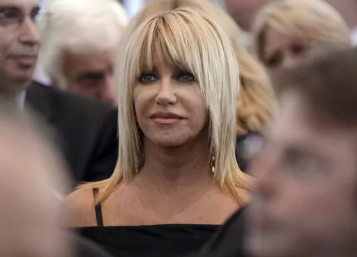 Suzanne Somers is seen during the funeral services for Merv Griffin at the Church of the Good Shepherd in Beverly Hills, Calif., Aug. 17, 2007. Somers, the effervescent blonde actor known for playing Chrissy Snow on the television show “Three’s Company,” as well as her business endeavors, died early Sunday, Oct. 15, 2023, her family said in a statement provided by her longtime publicist R. Couri Hay. She was 76. (AP Photo/Kevork Djansezian, Pool, File)