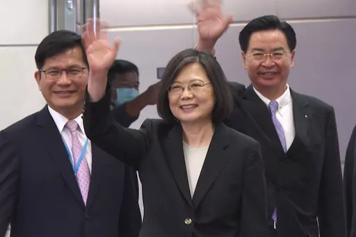 In this image made from video, Taiwan's Presidential office secretary general Lin Chia-lung, left, President Tsai Ing-wen, center, and Foreign Minister Joseph Wu wave before Tsai's departure on an overseas trip at Taoyuan International Airport in Taipei, Taiwan, Wednesday, March 29, 2023. China has threatened "resolute countermeasures" over a planned meeting between Taiwanese President Tsai Ing-wen and Speaker of the United States House Speaker Kevin McCarthy during an upcoming visit in Los Ange