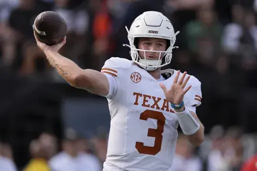 Texas quarterback Quinn Ewers (3) looks to throw a pass during the first half of an NCAA college football game against Vanderbilt, Saturday, Oct. 26, 2024, in Nashville, Tenn. (AP Photo/George Walker IV)