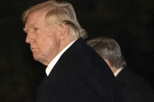 President Donald Trump walks across the South Lawn of the White House, Sunday, March 2, 2025, in Washington, after returning from a trip to Florida. (AP Photo/Mark Schiefelbein)