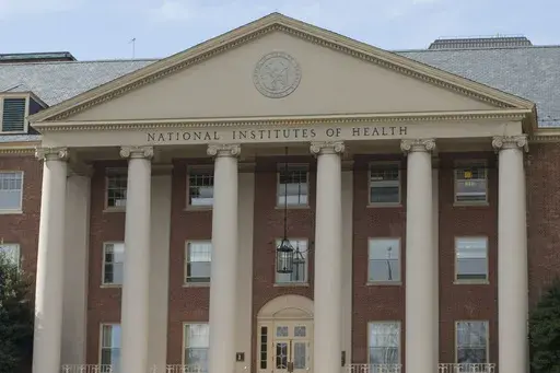 The National Institutes of Health's James Shannon building is seen on the agency's campus in Bethesda, Md., Friday, Oct. 24, 2014. (AP Photo/Pablo Martinez Monsivais, File)