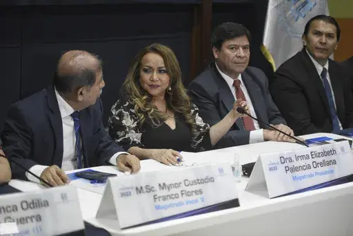 Supreme Electoral Tribunal magistrates hold a press conference in Guatemala City, Wednesday, July 12, 2023. The tribunal certified presidential election results, sending candidates Sandra Torres and Bernardo Arévalo to an Aug. 20 runoff, while the Attorney General's Office announced that Arevalo´s party had been suspended. (AP Photo/Wilder Lopez)