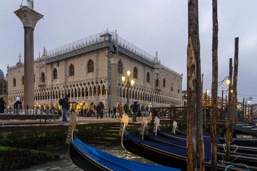 External view of the Palazzo Ducale in Venice, northern Italy, Tuesday, Dec. 6, 2022. The Doge's Palace, the heart of the political life of the Venetian Republic for centuries, is undergoing a major reconnaissance of its conservation status by the Fondazione Musei Civici of the municipality of Venice that includes the urgent restoration of its paintings and infrastructures, which is expected to be completed in the summer of 2023. (AP Photo/Domenico Stinellis)