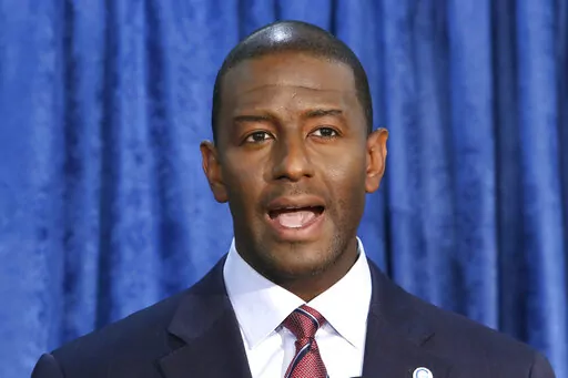 In this Nov. 10, 2018 file photo, Andrew Gillum, then-Democratic candidate for governor, speaks at a news conference in Tallahassee, Fla. Gillum, the 2018 Democratic nominee for Florida governor, is facing 21 federal charges related to a scheme to seek donations and funnel a portion of them back to him through third parties. The U.S. attorney's office announced the indictment Wednesday, June 22, 2022.  (AP Photo/Steve Cannon, File)