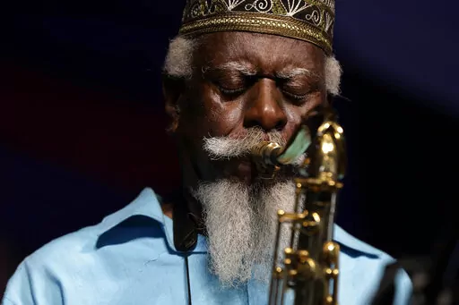 Jazz saxophonist Pharoah Sanders performs at the New Orleans Jazz and Heritage Festival in New Orleans, Friday, May 2, 2014. The influential tenor saxophonist revered in the jazz world for the spirituality of his work, has died, his record label announced on Saturday, Sept. 24, 2022. He was 81. (AP Photo/Gerald Herbert, File)