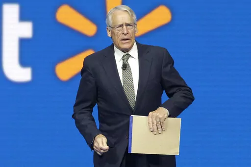 Walmart Chairman Rob Walton speaks at the company shareholders meeting in Fayetteville, Ark., June 5, 2015. The Walton family has won the bidding to purchase the Denver Broncos in the most expensive deal for a sports franchise anywhere in the world. The Broncos announced late Tuesday night, June 7, 2022, that they had entered into a sale agreement with the Walton-Penner ownership group led by Walmart heir Rob Walton, his daughter, Carrie Walton Penner, and her husband, Greg Penner. (AP Photo/Dan