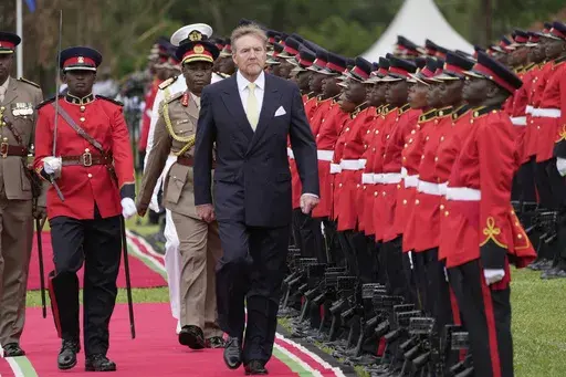 King Willem-Alexander of the Netherlands reviews the honor guard after arriving to meet with Kenya's President William Ruto at State House in Nairobi, Kenya, Tuesday, March 18, 2025. (AP Photo/Brian Inganga)