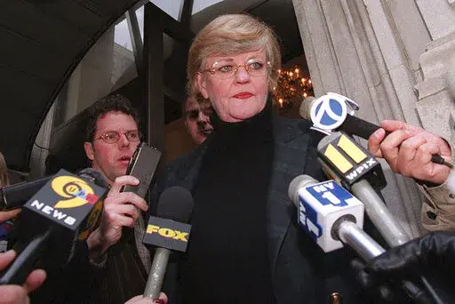 New York literary agent Lucianne Goldberg addresses a large assembly of media outside her apartment Saturday, Jan. 24, 1998, in New York. Goldberg, a key figure in the 1998 impeachment of President Bill Clinton over his affair with Monica Lewinsky, has died, Wednesday, Oct. 26, 2022 at the age of 87. (AP Photo/Emile Wamsteker, File)