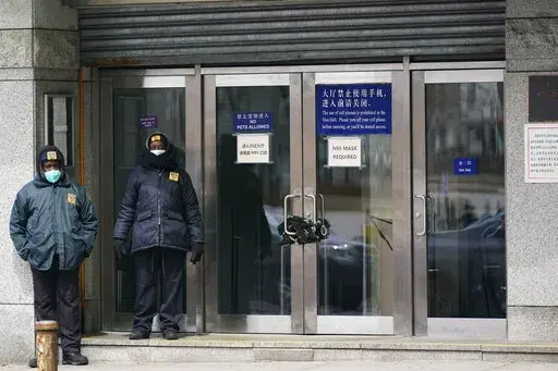 Guards stand outside of the Chinese consulate in New York, on March 28, 2022. Some of China's state media reporters are identifying as travel bloggers and lifestyle influencers on U.S.-owned social media platforms such as Instagram, Facebook and YouTube, racking up millions of followers from around the globe. The Associated Press has identified dozens of these accounts, which are part of a network of profiles that allow China to easily peddle propaganda to unsuspecting social media users.  (AP P