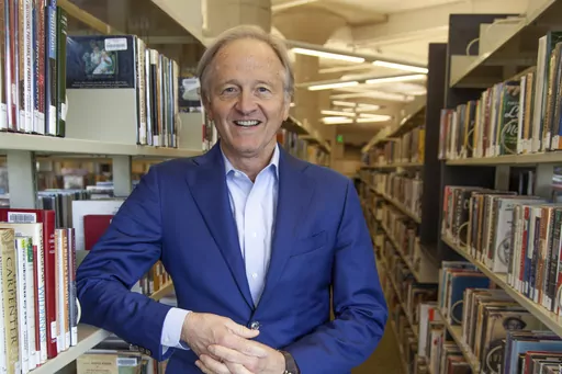 Nate Coulter executive director of the Central Arkansas Library System (CALS) poses for a photo in the main branch of the public library in downtown Little Rock, Ark., on May 23, 2023. A federal lawsuit filed Friday, June 2, 2023, challenges an Arkansas law that would subject librarians and booksellers to criminal charges if they provide “harmful” materials to minors. (AP Photo/Katie Adkins, File)