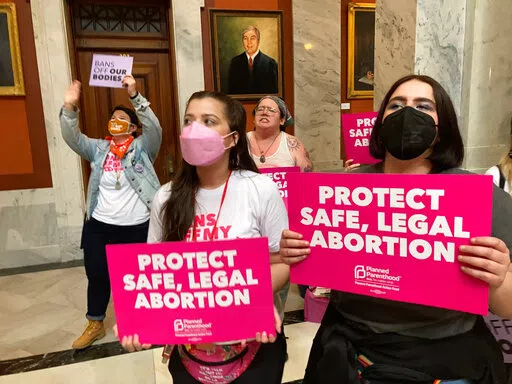 Abortion-rights supporters chant their objections at the Kentucky Capitol on Wednesday, April 13, 2022, in Frankfort, Ky., as Kentucky lawmakers debate overriding the governor's veto of an abortion measure.   A federal judge on Thursday, April 21, 2022, temporarily blocked a state law that effectively eliminated abortions in Kentucky after the state’s two remaining clinics said they couldn’t meet its requirements. (AP Photo/Bruce Schreiner, File)