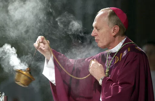 Bishop Howard Hubbard swings incense during an Ash Wednesday communion service at the Cathedral of the Immaculate Conception on Feb. 25, 2004, in Albany, N.Y. Hubbard, now retired and who has admitted to covering up for predator priests and has himself been accused of sexual abuse, has asked Pope Francis to laicize him, or remove him from the priesthood. Hubbard, 84, announced the decision in a statement Friday, Nov. 18, 2022, the day the United Nations has designated as the World Day for Previo