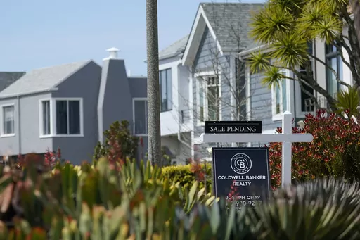 A Sale Pending sign hangs in front of a property in San Francisco, Tuesday, April 18, 2023. Planning a wedding and buying a home are two of the most expensive milestones of adult life, and couples with both of these goals may wonder how they’ll pay for it all. After all, new mortgages cost more now than ever, and wedding catering alone can easily cost five figures. (AP Photo/Jeff Chiu, File)