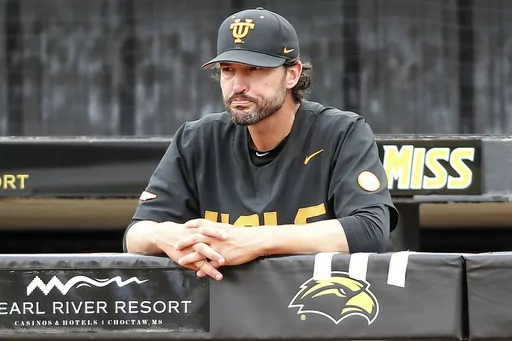Tennessee head coach Tony Vitello stands in the dugout during a lighting delay in an NCAA college baseball tournament super regional game against Southern Mississippi in Hattiesburg, Miss., Saturday, June 10, 2023. Vitello has built his offense around the long ball. No team in the country has hit more homers than the Volunteers' 500 since 2020. (James Pugh/impact601.com via AP, File, File)