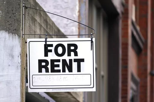 A "For Rent" sign is posted on a building, Tuesday, Jan. 18, 2022, in Philadelphia. The federal rental assistance is running out in some places, which is putting pressure on the U.S. Treasury Department to shift remaining funds to the states and cities most in need. Treasury has shifted more than $2 billion mostly to states and cities with a higher concentration of renters and away from small, mostly rural states. (AP Photo/Matt Rourke, File)