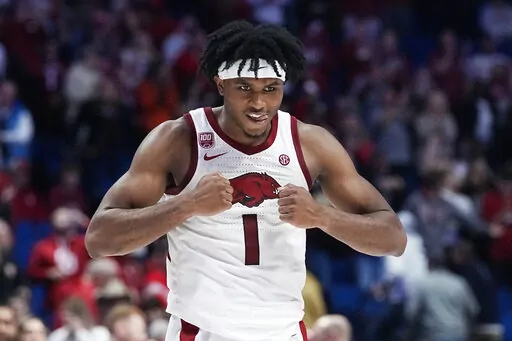 Arkansas guard Ricky Council IV (1) celebrates after Arkansas defeated Oklahoma in an NCAA college basketball game Saturday, Dec. 10, 2022, in Tulsa, Okla. (AP Photo/Sue Ogrocki)