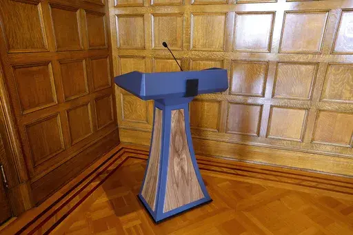 The lectern purchased by the administration of Arkansas Gov. Sarah Huckabee Sanders in June 2023 sits in a corner in the Governor's Conference Room at the state Capitol, Sept. 26, 2023, in Little Rock, Ark. A prosecutor said Friday, June 7, 2024, he will not file any criminal charges over the purchase of a $19,000 lectern by the governor's office that attracted nationwide scrutiny. (Thomas Metthe/Arkansas Democrat-Gazette via AP, File)
