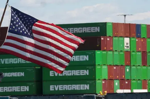 Containers are stacked at the Port of Los Angeles ,Wednesday, April 2, 2025, in Los Angeles. (AP Photo/Damian Dovarganes)