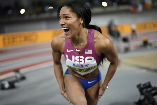 Tara Davis-Woodhall, of the United States, reacts after winning the gold medal in the women's long jump during the World Athletics Indoor Championships at the Emirates Arena in Glasgow, Scotland, Sunday, March 3, 2024. (AP Photo/Bernat Armangue)