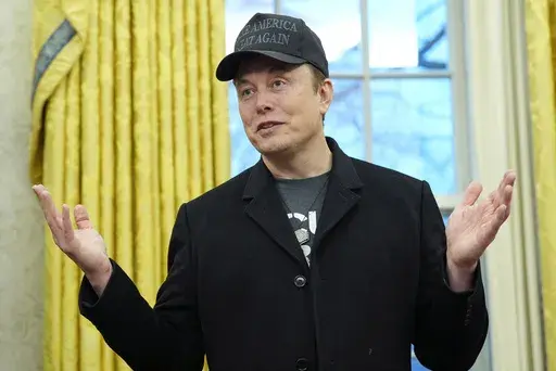 Elon Musk speaks during an event with President Donald Trump in the Oval Office at the White House, Feb. 11, 2025, in Washington. (AP Photo/Alex Brandon)