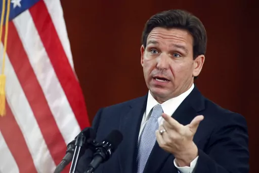 Florida Gov. Ron DeSantis answers questions from the media in the Florida Cabinet following his State of the State address during a joint session of the Senate and House of Representatives, Tuesday, March 7, 2023, at the state Capitol in Tallahassee, Fla. DeSantis' administration is moving to unilaterally forbid classroom instruction on sexual orientation and gender identity in all grades, expanding the controversial law critics call “Don't Say Gay” as the Republican governor continues a foc