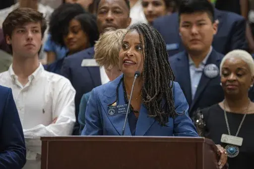 Georgia state Sen. Nikki Merritt, D–Grayson, delivers remarks at a joint Senate and House press conference on the State School Superintendent's decision to block an AP African American Studies course at the Georgia State Capitol, Wednesday, July 24, 2024, in Atlanta. (Matthew Pearson/WABE via AP)