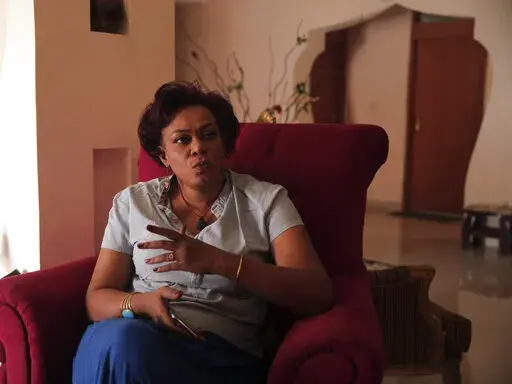 Amira Osman sits at her home after being released from detention, in Khartoum, Sudan, Wednesday, February 9, 2022. Osman is one of scores of pro-democracy activists and protesters who have been detained without charge since a military coup in October deposed the transitional government, in what many fear is a return to the tactics of autocrat former President Omar al-Bashir. (Marwan Ali/AP)