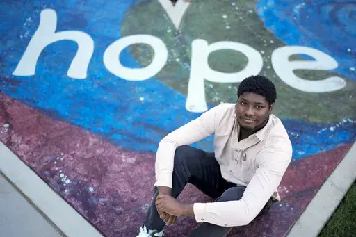 Nick poses for a portrait on the campus of St. Jude Children's Research Hospital, Wednesday, Oct. 2, 2024, in Memphis, Tenn. Nick was diagnosed with lymphoblastic leukemia in 2014 and is now in remission. (AP Photo/George Walker IV)