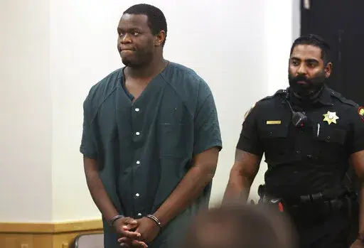 Reginald Kimbro enters the courtroom of Tarrant County's 213th District Court on Friday, March 18, 2022, in Fort Worth, Texas. Kimbro was sentenced to three life sentences for the murder of two North Texas women and a series of rapes. (Amanda McCoy/Star-Telegram via AP)