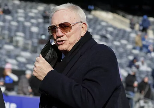 Dallas Cowboys owner Jerry Jones is seen on the field before an NFL football game between the New York Giants and the Cowboys on Dec. 19, 2021, in East Rutherford, N.J. A 25-year-old Texas woman who sued Jones, alleging he is her biological father, has dropped her lawsuit. Alexandra Davis said in court papers filed Wednesday, April 20, 2022, that she now wants genetic testing to verify her claim, the Dallas Morning News reported.(AP Photo/Corey Sipkin, File)