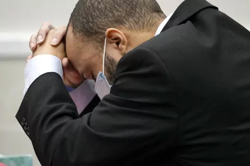 Darrell Brooks reacts as the guilty verdict is read during his trial in a Waukesha County Circuit Court in Waukesha, Wis., on Wednesday, Oct. 26, 2022. Brooks, who is represented himself during the trial, was charged with driving into a Waukesha Christmas Parade last year, killing six people and injuring dozens more. (Mike De Sisti/Milwaukee Journal-Sentinel via AP, Pool)