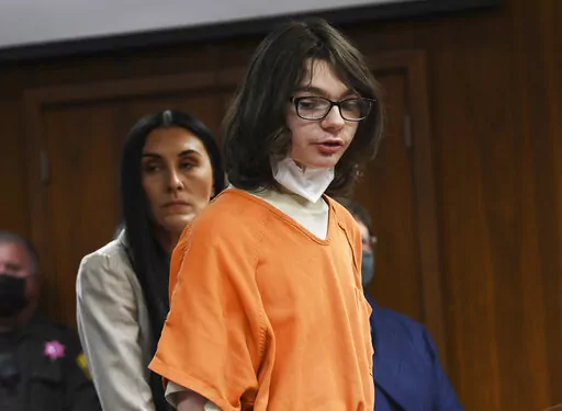 Ethan Crumbley answers yes to charges against him from assistant prosecutor during his pre-trial hearing at Oakland County Courthouse, Monday, Oct. 24, 2022. Pontiac, Mich. Crumbley entered the guilty plea to 24 criminal charges including terrorism causing death and first-degree murder for the Oxford High School shooting. (Clarence Tabb Jr./Detroit News via AP)