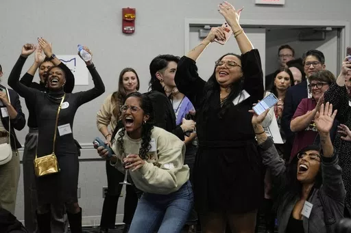 Issue 1 supporters celebrate as Rhiannon Carnes, executive director, Ohio Women's Alliance, speaks at a watch party, Tuesday, Nov. 7, 2023, in Columbus Ohio. (AP Photo/Sue Ogrocki)